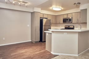 Escondido Apartments for Rent - Alta Vista - Apartment Kitchen Area with Dining Section and Wood-Style Flooring