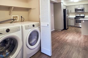 Laundry Closet with In-Unit Washer And Dryer, Folding Louver Door, and View of Kitchen Area  at Alta Vista, Escondido, 92026