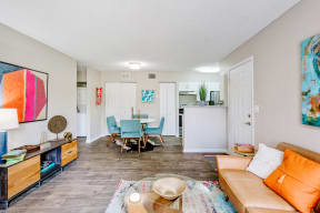 Living room with view of dining room and front door