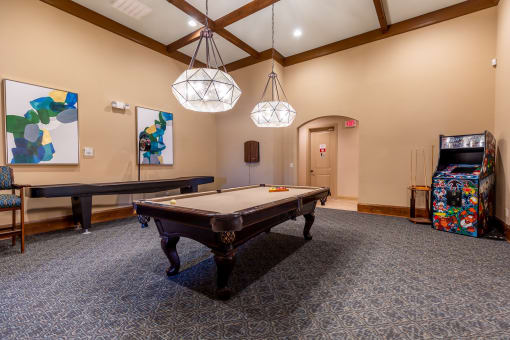 a billiards room with a pool table