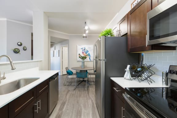 a kitchen and dining area in a 555 waverly unit