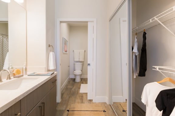 a bathroom with a sink and a toilet in a 555 waverly unit