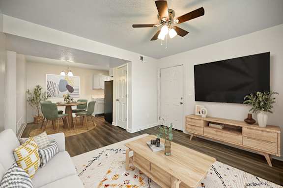 A bedroom with a large bed and a flat screen TV.
