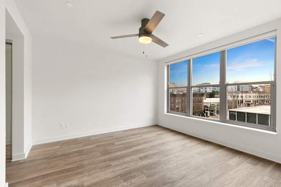 Room with ceiling fan and large windows at AVIA on Pike Street, Seattle, WA, 98101