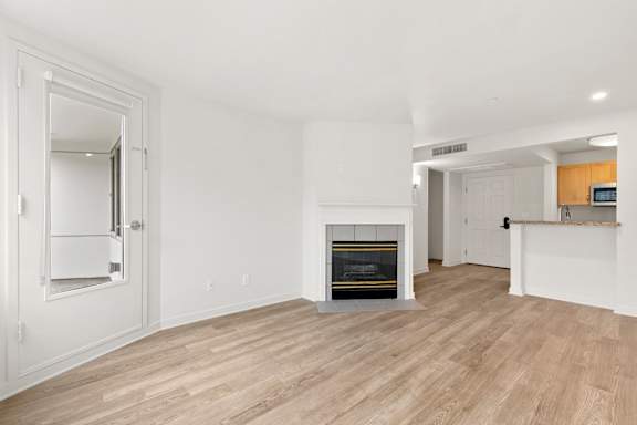 Room with mirror and fireplace at AVIA on Pike Street, Seattle