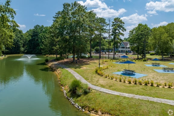 a park with a lake and a fountain