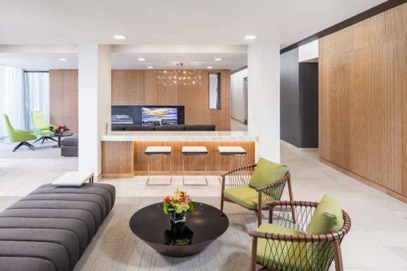 a living room filled with furniture and a flat screen tv