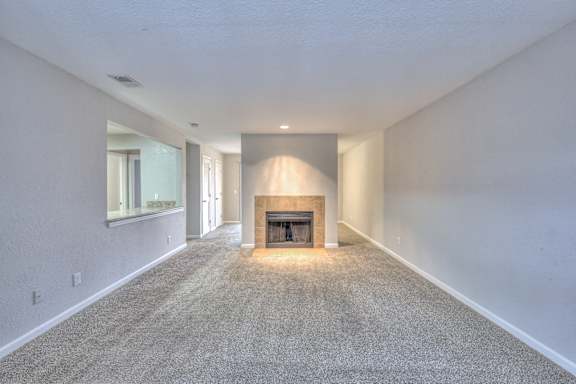 A long, empty hallway with a fireplace at the end at Landmark at Lyncrest Reserve Apartments, Nashville, TN, 37209