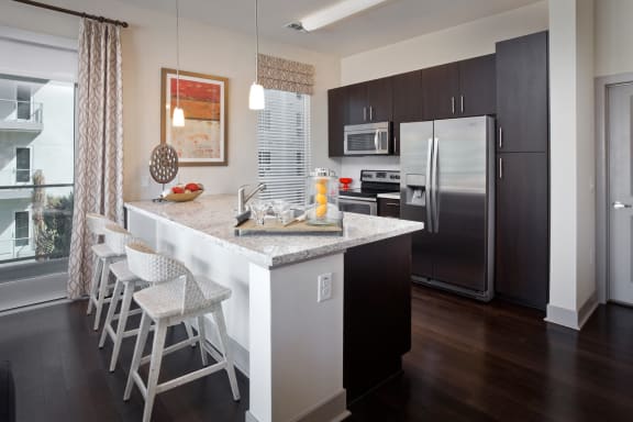 Open-Concept Kitchens with Stainless Steel Appliances at South Park by Windsor, 939 South Hill Street, CA