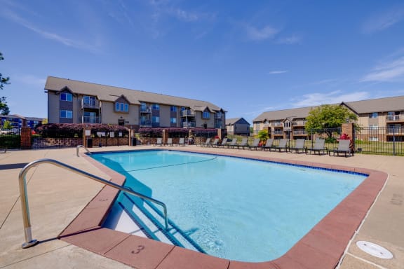 Surrounded by the beauty of the clubhouse grounds, the sparkling pool invites residents to relax and enjoy leisurely moments.