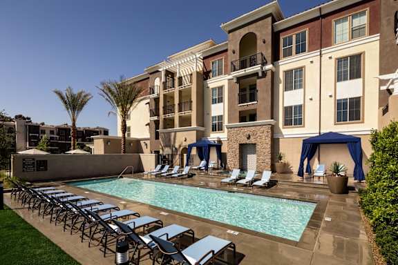 Adagio on the Green Apartments in Mission Viejo, California Exterior and Pool with Lounge Chairs