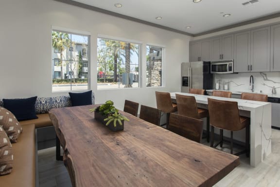 Clubroom kitchen and dining area at The Grove Apartments, California