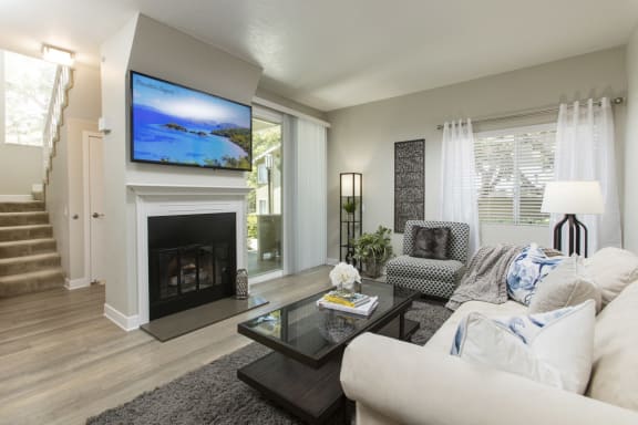 Apartments for Rent in Dana Pointe - Harbor Pointe - Living Room with Fireplace, Glass Countertop, and Spacious Window at Harbor Pointe, Dana Point, California