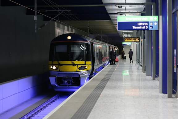 A train is at the station and ready to depart.