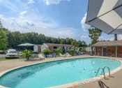 Thumbnail 2 of 8 - Pool with lounge chairs at Landmark Apartment Homes, Mississippi