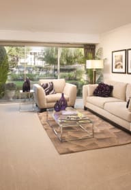 a living room with white furniture and a large window at Versailles on the Lakes Oakbrook*, Oakbrook Terrace, 60181