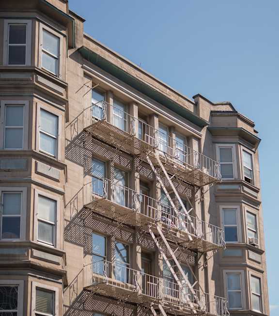 a view of the top of a building with a fire escape