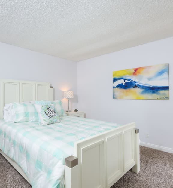 a bedroom with a bed and two night stands
