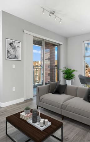 a living room with a grey couch and a coffee table
