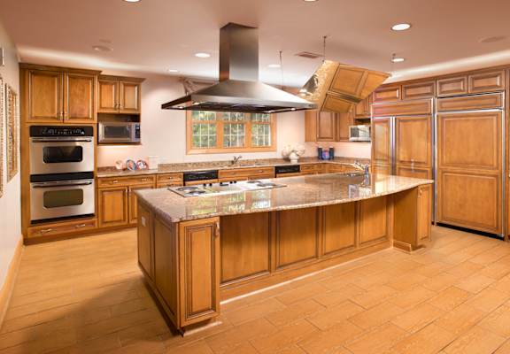 a large kitchen with wooden cabinets and a counter top at Versailles on the Lakes Oakbrook*, Oakbrook Terrace, 60181