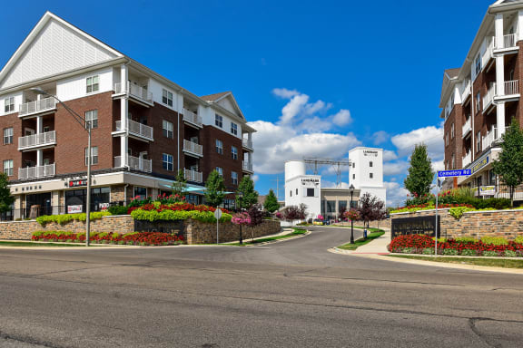 an empty street with an apartment building on the side of it
