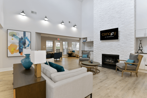 the reserve at bucklin hill clubhouse with fireplace and seating