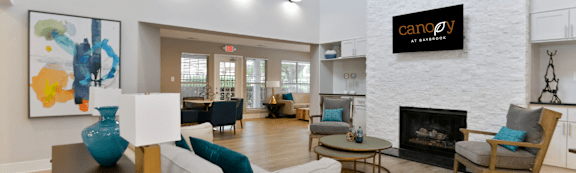 the reserve at bucklin hill clubhouse with fireplace and seating