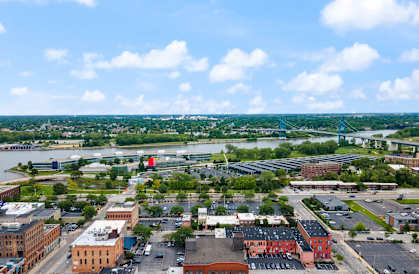 an aerial view of a city with buildings and a river