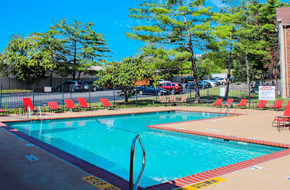 A pool with a red and yellow striped border.