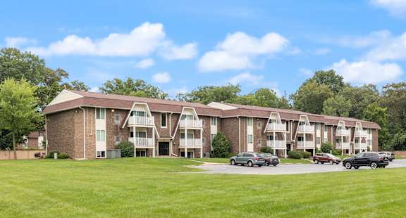 apartment building with cars parked in South Toledo