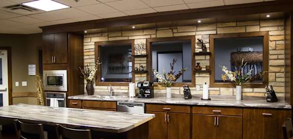 a kitchen with a table and chairs