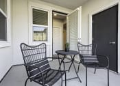 Thumbnail 27 of 34 - Outside Patio with Chairs and Table