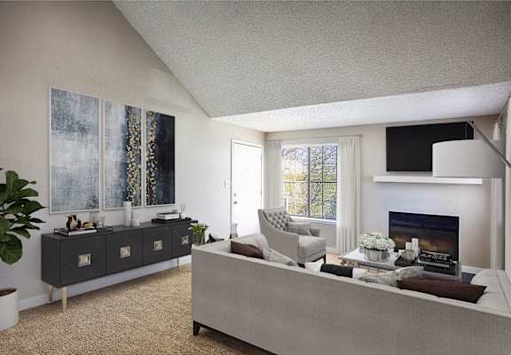 a living room with a white couch and a fireplace at Skyview Apartments, Westminster