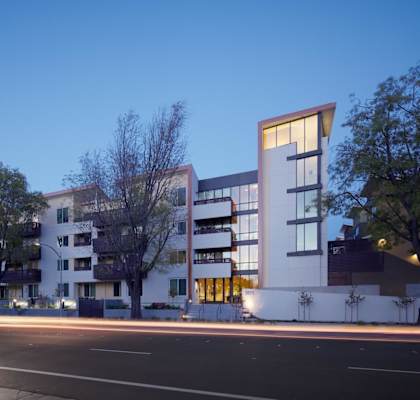 a development of apartments on a city street at night