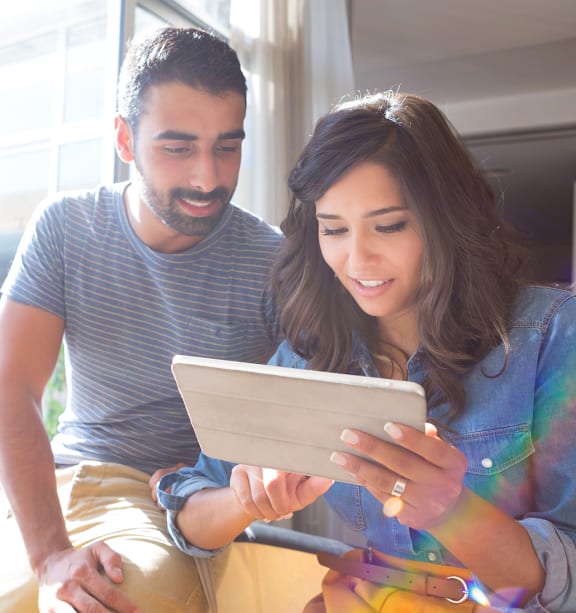 Couple looking at tablet