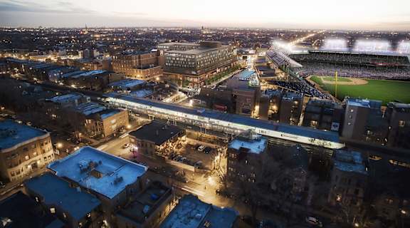 an aerial view of a city at night with a baseball stadium at Residences at Addison Clark Apartments, Illinois