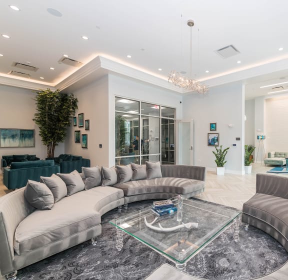 a lobby with couches and a glass coffee table at The Residences of Wilmette, Wilmette, Illinois