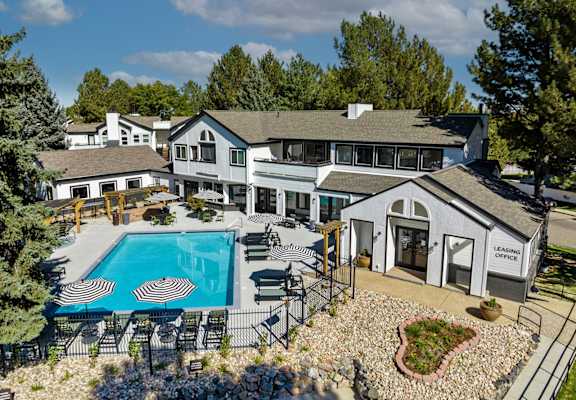 A large house with a pool in the backyard.