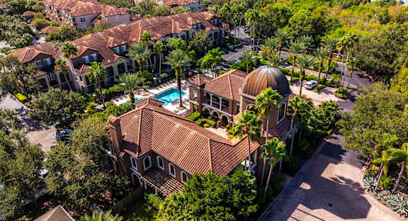 Elevated aerial of clubhouse with domed roof and landscaped courtyard