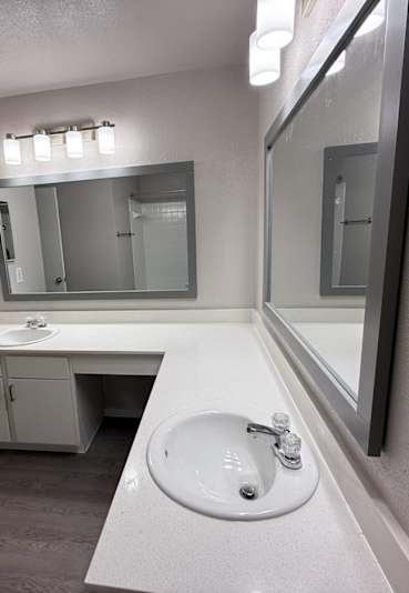 A bathroom with a sink and mirror at Brook Meadow Village Apartments , Austin, TX, 78758