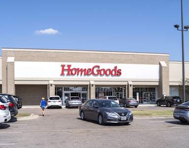 A HomeGoods store with cars parked in front.