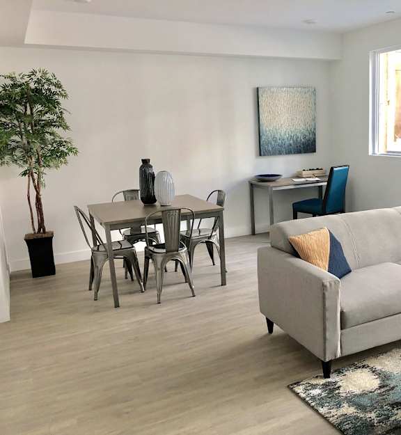 an empty room with a sliding glass door and a hard wood floor