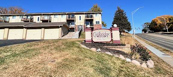 Cambridge Apartments sign placed at the main entrance to the property.