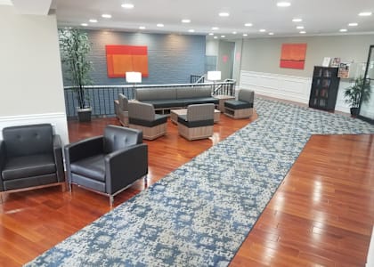 a large room with chairs and couches