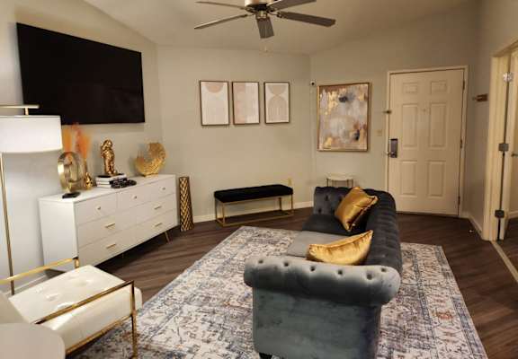 a living room with a couch and a tv