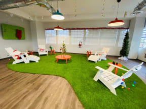 a living room with rocking chairs and a christmas tree