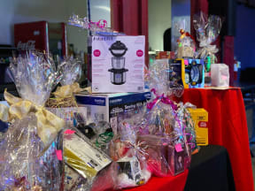 a table full of gift bags and a box of filtered water