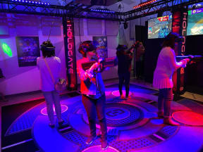 a group of people standing on a stage playing video game controllers