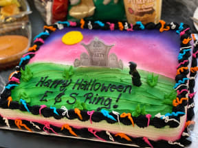 a birthday cake that says happy halloween and e is king