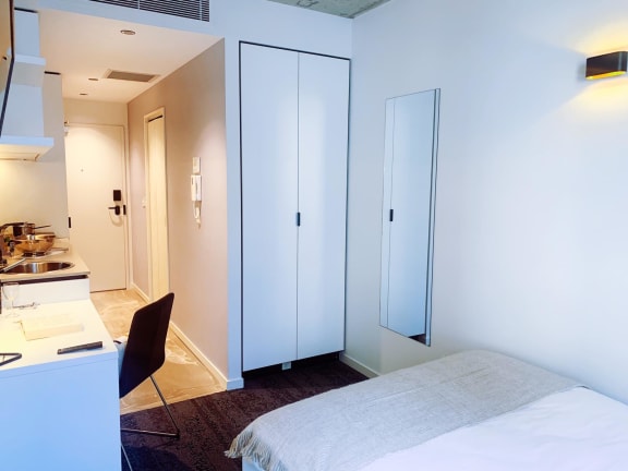 a bedroom with a bed and a closet